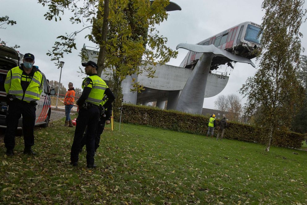 PHOTO: The whale's tail of a sculpture caught the front carriage of a metro train as it rammed through the end of an elevated section of rails with the driver escaping injuries in Spijkenisse, near Rotterdam, Netherlands, Monday, Nov. 2, 2020. 