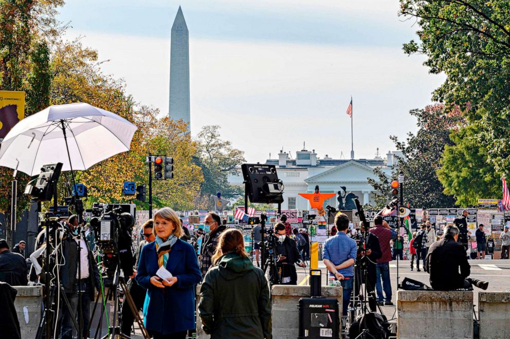 PHOTO: Journalists from all over the world wait for the result of the presidential election on Black Lives Matter Plaza in front of the White House on Nov. 6, 2020, in Washington.