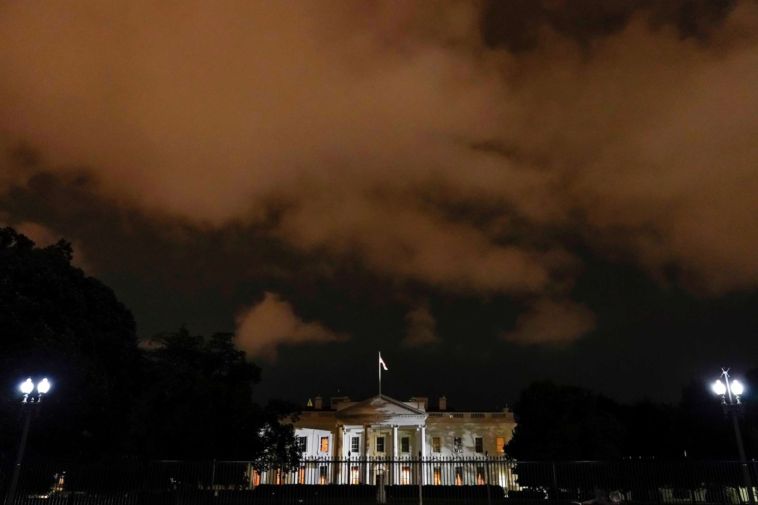 PHOTO: The White House is lit before dawn after President Donald Trump announced that he and first lady Melania Trump have both tested positive for COVID-19 in Washington, D.C., Oct. 2, 2020.