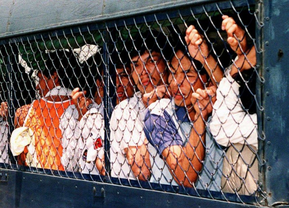 PHOTO: Vietnamese boat people from the Whitehead detention center are crowded into a police truck for relocation to another detention center in Hong Kong on April 7, 1994.