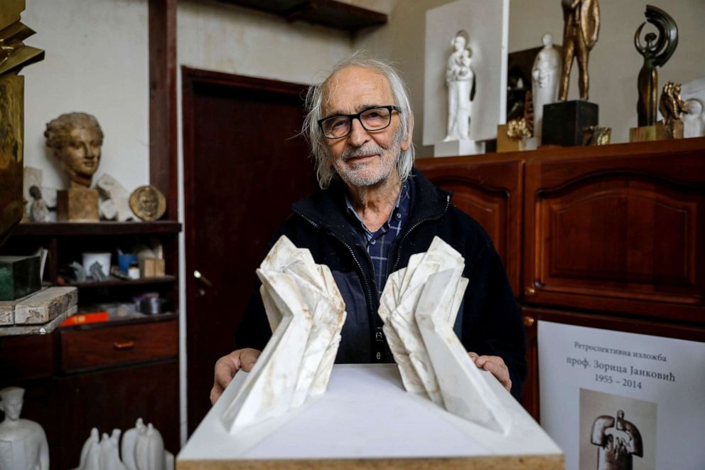 PHOTO: Miodrag Zivkovic, 91, architect of the "Battle of Sutjeska" memorial monument, poses for a picture with the original maquette in his home in Belgrade, Serbia, Feb. 27, 2019.