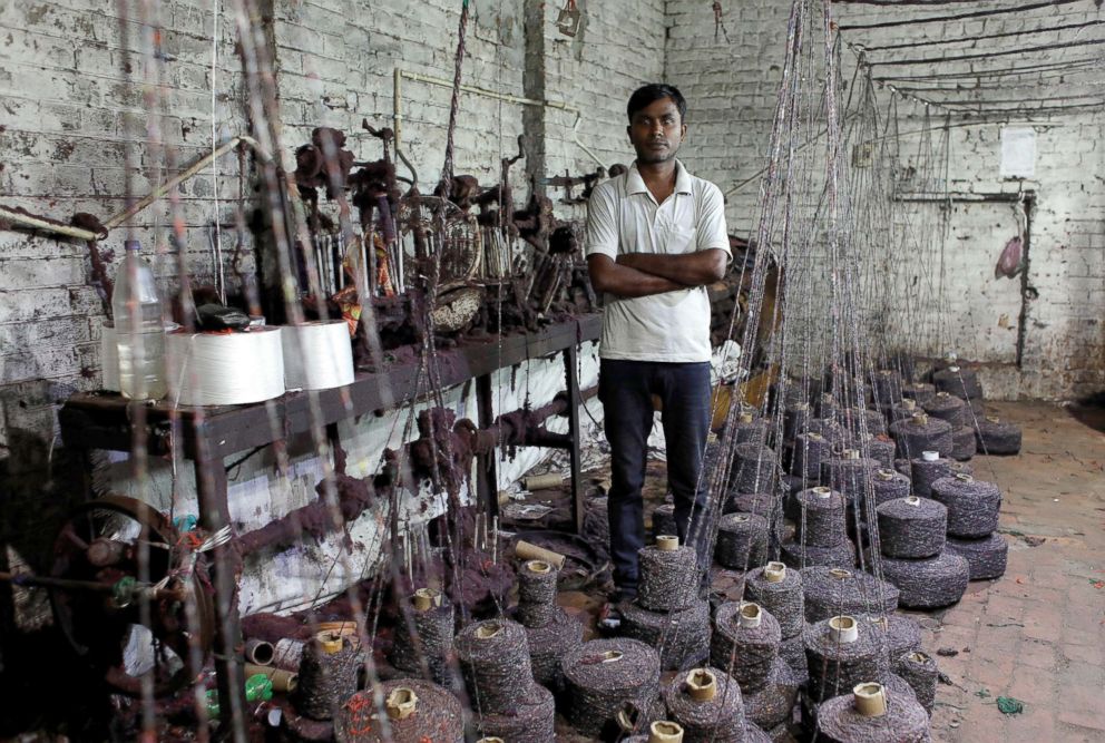 PHOTO: Ram Pratap, who lost his job as a powerloom operator earlier this year, poses for a picture inside a weaving factory where he used to work, in Panipat, India, Aug. 24, 2018.