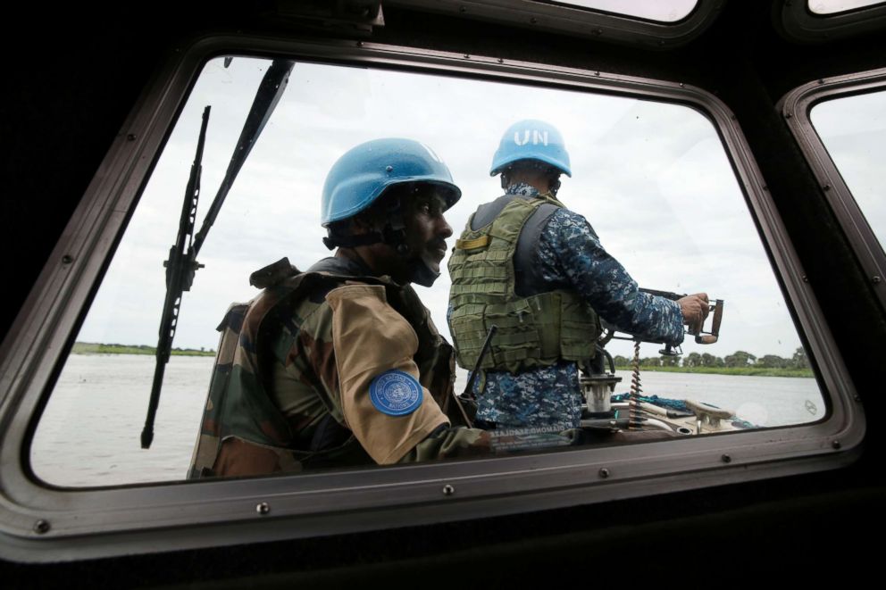 PHOTO: A Bangladeshi Navy peacekeeper (R) and an Indian army peacekeeper with UNMISS take part in a patrol on the white Nile near the town of Malakal, in the Upper Nile state of South Sudan, Sept. 8, 2018.