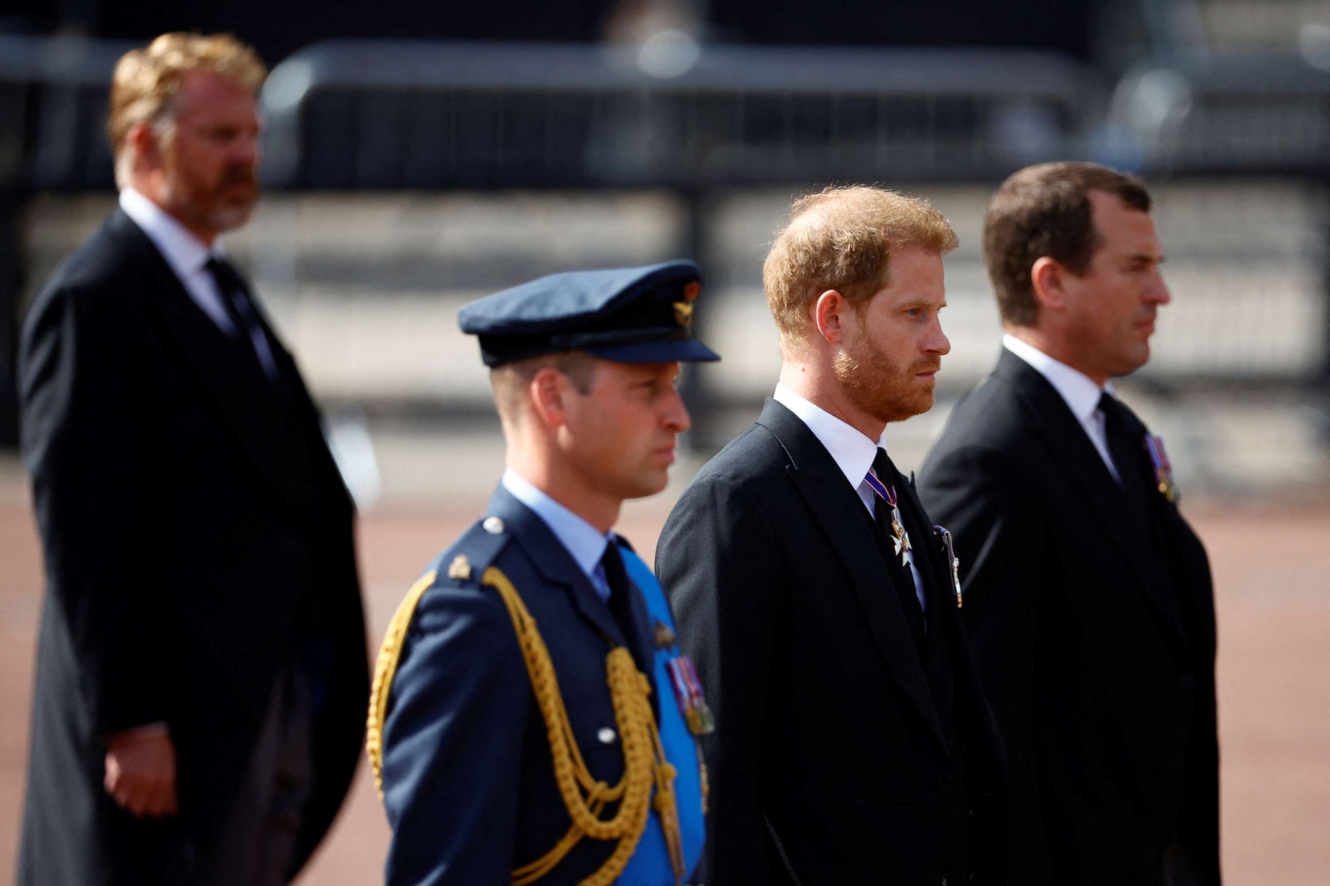 PHOTO: William, Prince of Wales and Prince Harry march during a procession where the coffin of Britain's Queen Elizabeth is transported from Buckingham Palace to the Houses of Parliament for her lying in state, in London, Sept. 14, 2022.