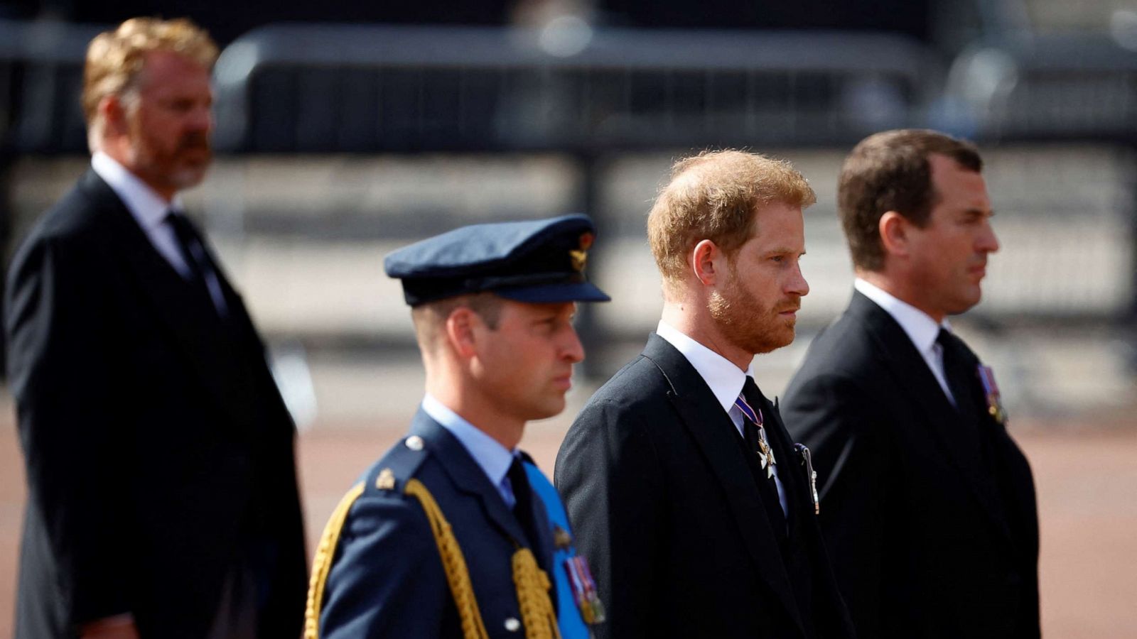 PHOTO: William, Prince of Wales and Prince Harry march during a procession where the coffin of Britain's Queen Elizabeth is transported from Buckingham Palace to the Houses of Parliament for her lying in state, in London, Sept. 14, 2022.