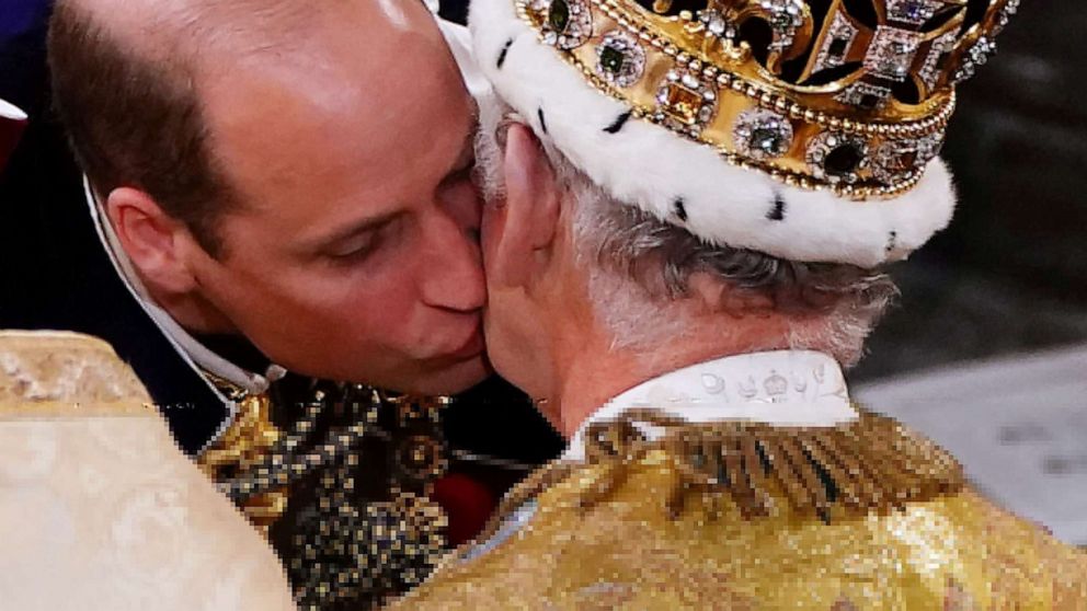 PHOTO: The Prince of Wales kisses his father King Charles III during his coronation ceremony in Westminster Abbey, London, May 6, 2023.