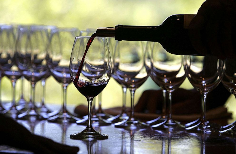 PHOTO: A worker at St. Supery winery pours a glass of wine for a tasting September 20, 2006 in Rutherford, California.