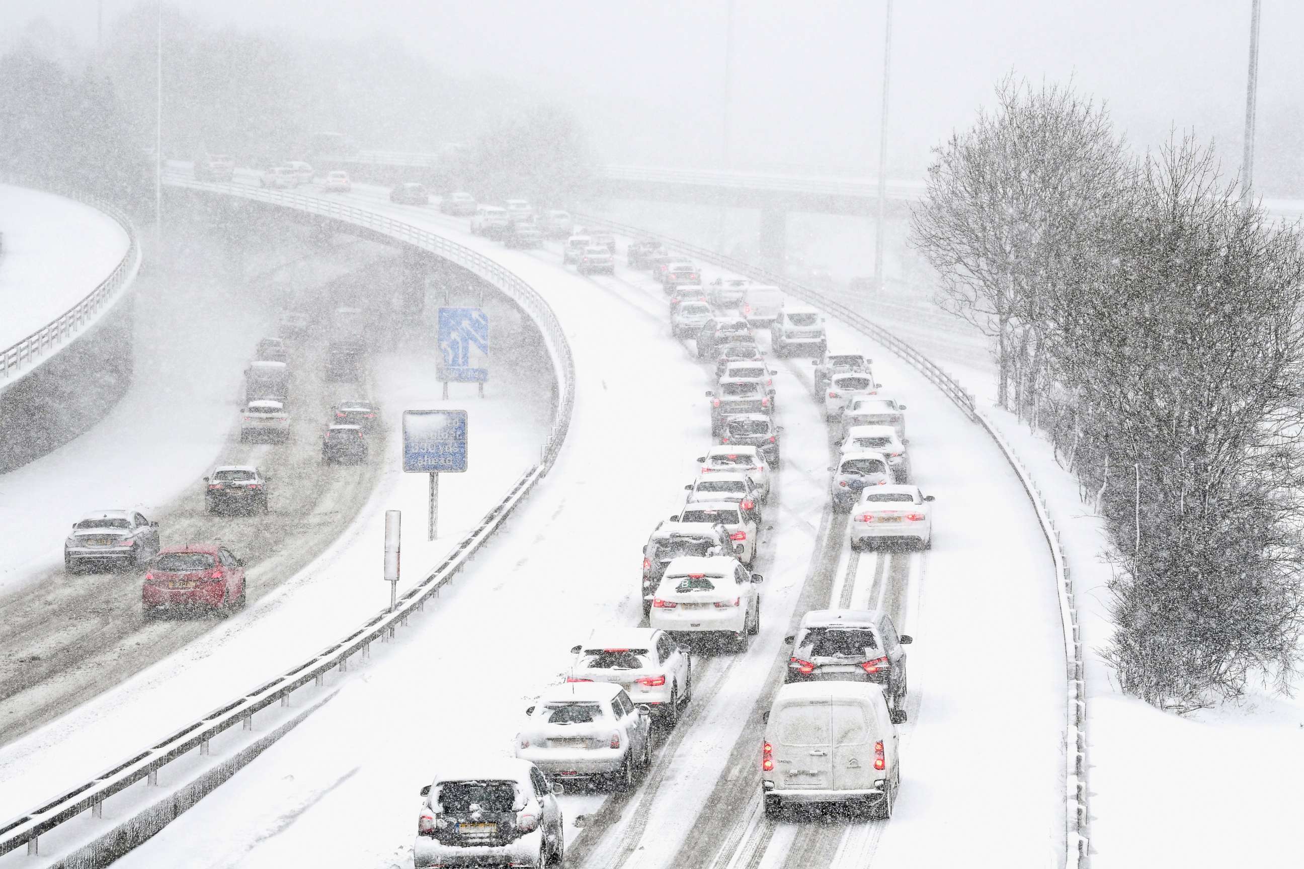 PHOTO: Vehicles drive through snow on the M8 in Glasgow, Feb. 28, in Glasgow, Scotland. 
