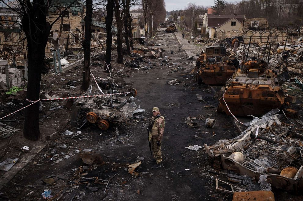 PHOTO: A Ukrainian soldier stands amid destroyed Russian tanks in Bucha, Ukraine, April 6, 2022.