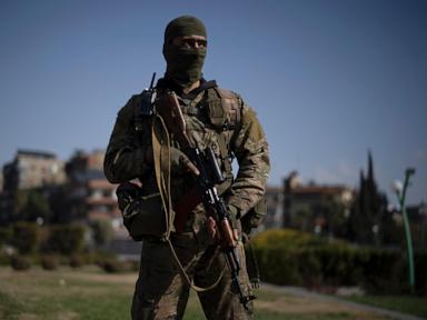 AP PHOTOS: Portraits of former Syrian rebels now soldiers