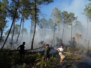 France firefighters hold wildfire at bay as heat returns