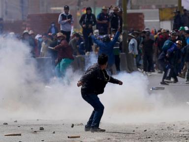 Rival protesters clash in Bolivia as ex-President Evo Morales leads a march to the capital