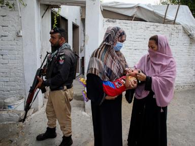 A roadside bomb hits a vehicle carrying police guarding an anti-polio drive in Pakistan, wounding 9