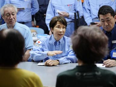 Prime minister visits quake-hit southern Japan as cleanup begins in intense heat