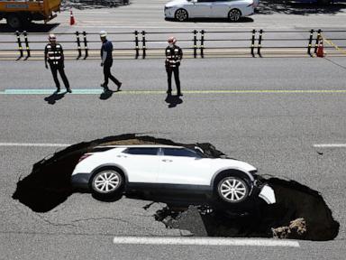 2 hurt after SUV swallowed by sinkhole