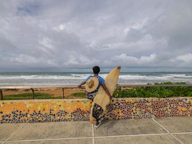 A strengthening Ernesto is poised to become a hurricane after brushing past Puerto Rico