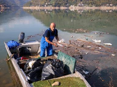 Residents and activists in central Bosnia clean up a lake after massive floods