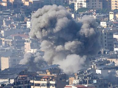 2 Israeli airstrikes hit Syria's capital and a suburb, killing 15 people, Syrian state media say