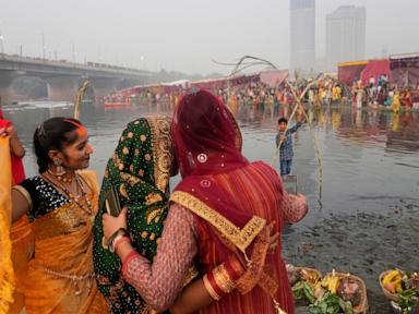 AP PHOTOS: Tens of thousands of Hindu devotees flock to rivers for prayers to the sun god