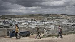  Cash-strapped Syrians living in tent settlements struggle to return home after Assad's fall