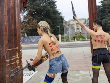 Topless women protesting the Ukraine war are detained for vandalizing sculpture near UN building