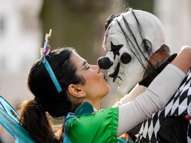 AP PHOTOS: Revelers in costumes take to the streets of Germany to kick off carnival celebrations