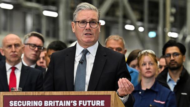 Louise Holmes, MBDA UK Deputy Managing Director, shows Britain's Defence Secretary John Healey, left, a storm shadow missile on an assembly line at the MBDA Storm Shadow factory in Stevenage, England, Saturday May 31, 2025. (Dan Kitwood/Pool via AP)