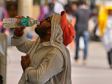 Heat wave empties roads and markets in north India as some farmers turn to nighttime work