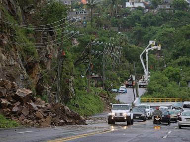 John as a tropical storm hits Mexico's Pacific coast a 2nd time