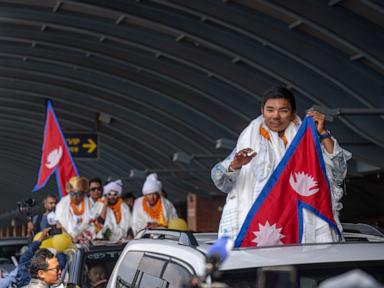 A record-setting teen climber returns home to Nepal to a hero's welcome