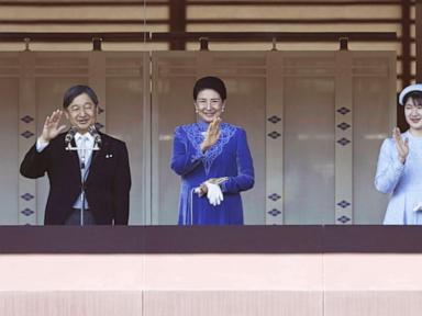 Japan's emperor marks 65th birthday with a call to keep telling the tragedy of WWII