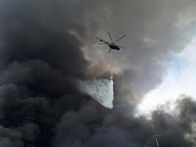 Iran's president visits those injured in the port explosion that killed at least 40 people