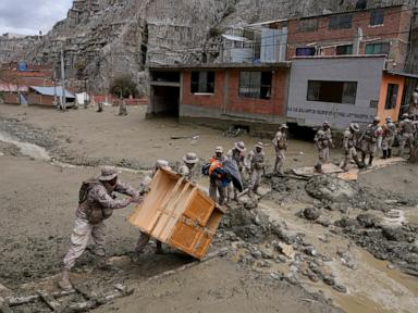 Heavy rains in Bolivia send mud crashing into the capital, leaving 1 missing and destroying homes