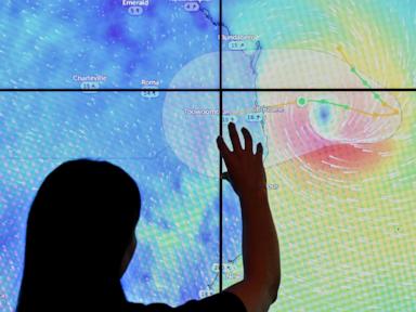 Schools are closed and public transport has stopped as rare cyclone approaches Australian coast