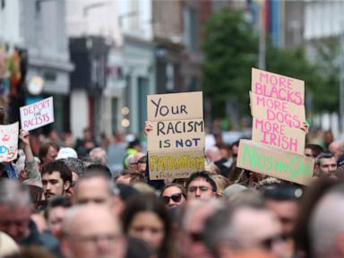 Thousands rally in Belfast to condemn anti-immigrant rioting that followed stabbing