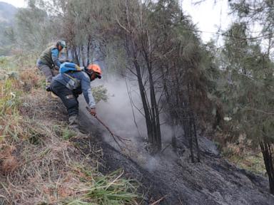 Wildfire at Indonesia's Mount Bromo mostly contained as smoke forces school closures
