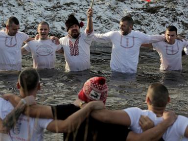 Bulgarians celebrate the feast of Epiphany with a ritual plunge into icy rivers