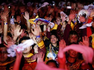 Filipino Catholics pray for good health and peace in huge procession venerating Jesus statue