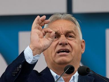 Hungary’s Orbán interrupted by activist during EU presidency news conference