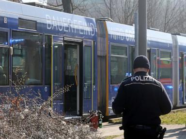 An assailant sets a woman alight on a tram in eastern Germany and flees