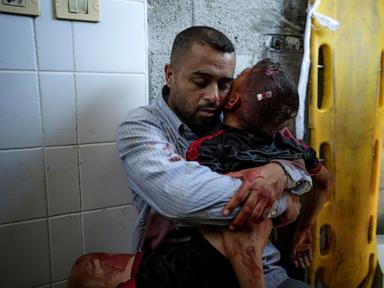 A boy in Gaza was killed by an Israeli airstrike. His father held him and wouldn't let go