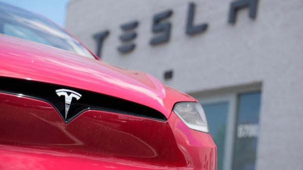 FILE - A Model X sports-utility vehicle sits outside a Tesla store in Littleton, Colo., June 18, 2023. (AP Photo/David Zalubowski, File)