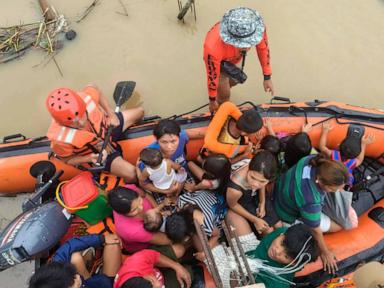 Tropical storm battering Philippines leaves at least 24 people dead in flooding and landslides