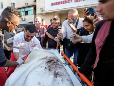 A Gaza medic realizes he's carrying his own mother's body, killed by an Israeli airstrike