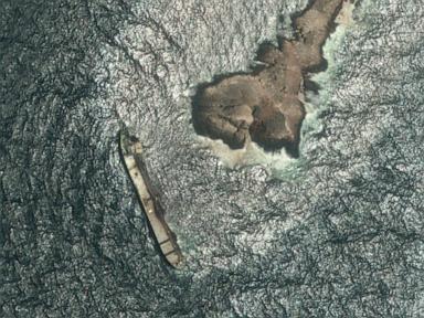 Oman says the oil spill from a grounded tanker has reached its coastline