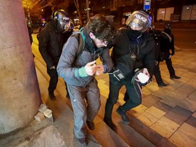 Georgian protesters and police clash after prime minister suspends talks on joining the EU