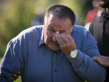 Hundreds attend a funeral service in southern Bosnia for 19 killed in devastating floods