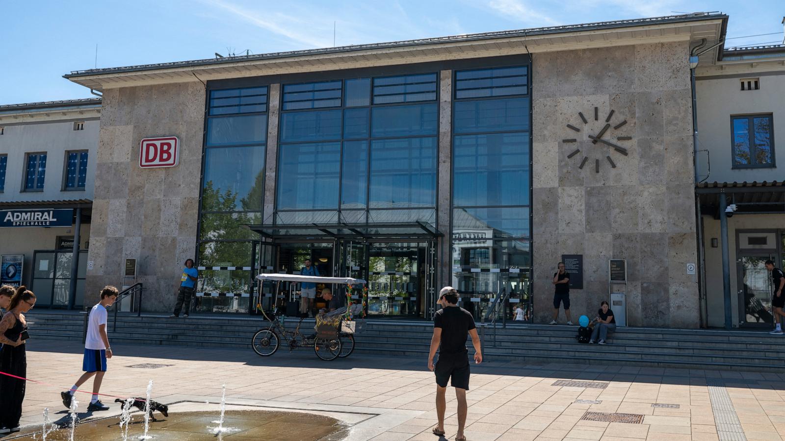 A British woman is fatally stabbed at a station in Germany. Police detain a suspect