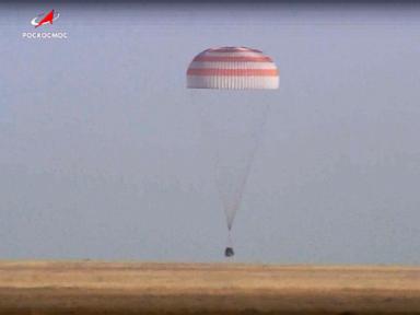 A Soyuz capsule with 2 Russians and 1 American from the International Space Station returns to Earth