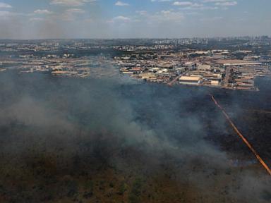 Brazilian firefighters battle national park wildfire that is enveloping Brasilia in smoke